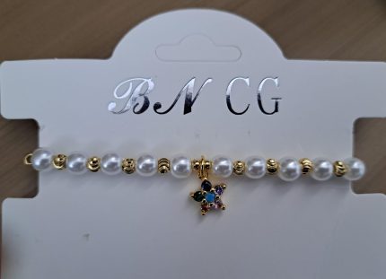 Pulseras en perlas con dije